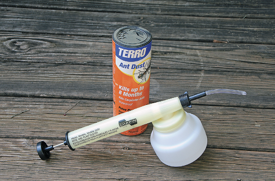 A spray device and a can of ant dust.