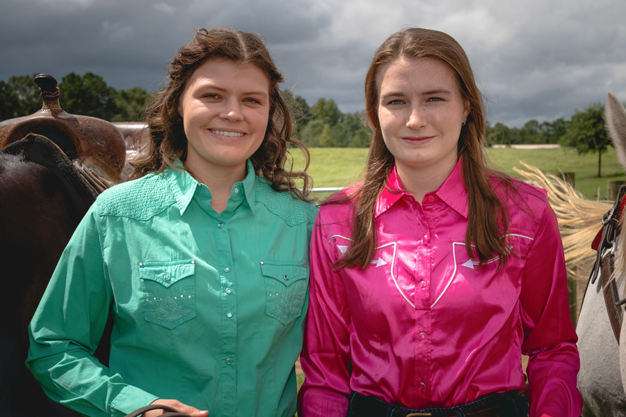 Two women smiling.