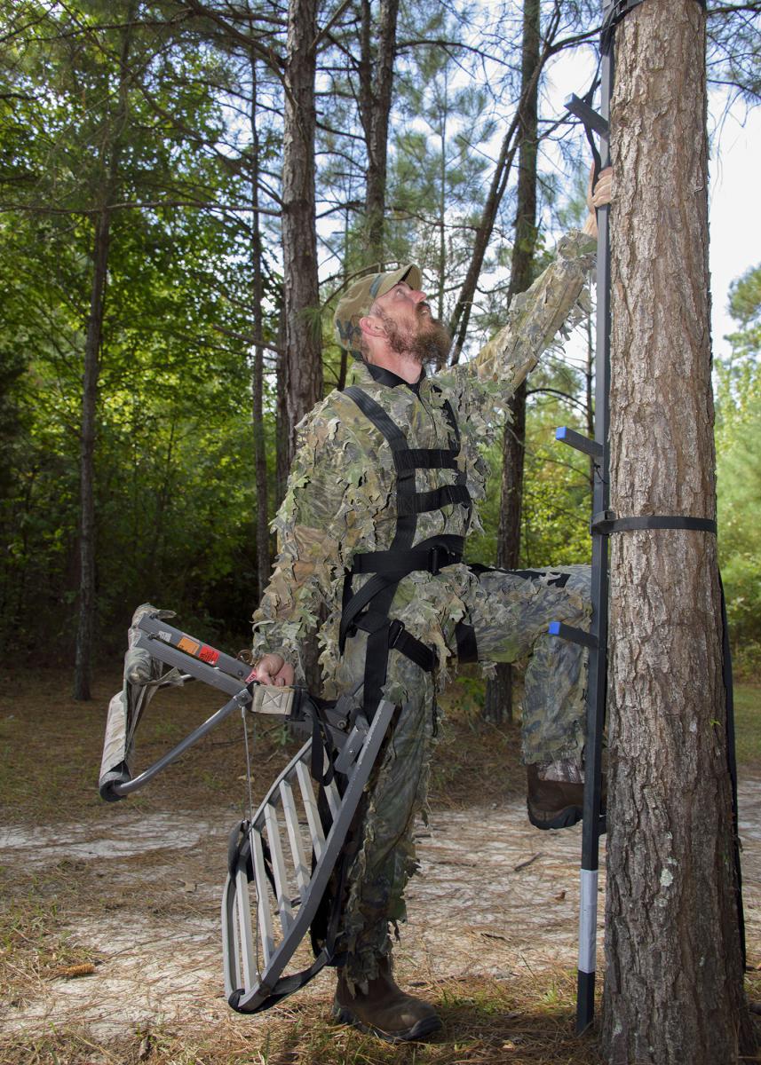 Many falls from tree stands occur when hunters are climbing to a stand or when they are coming down. The majority of hunters fail to wear fall restraint systems during this critical time. (Illustrated photo by MSU Extension Service/Kevin Hudson)