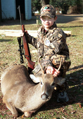 A young boy that has been hunting