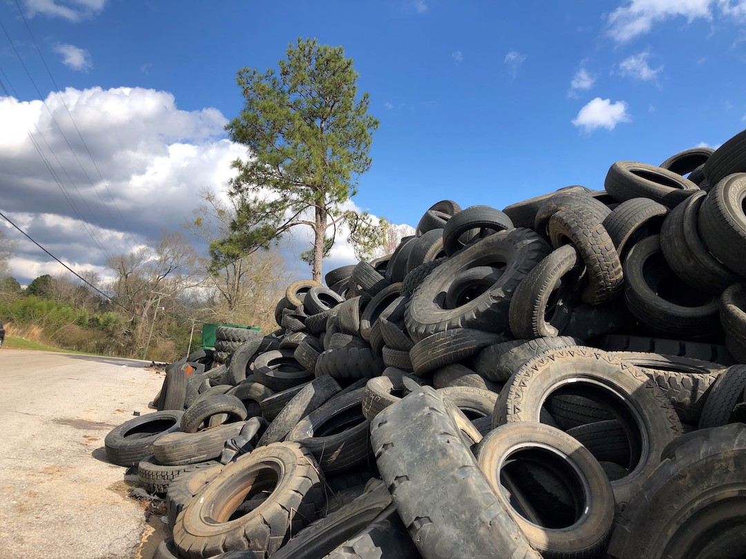 Large stack of used tires.
