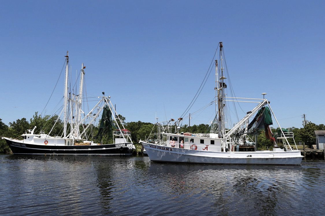 Two fishing boats at a dock.