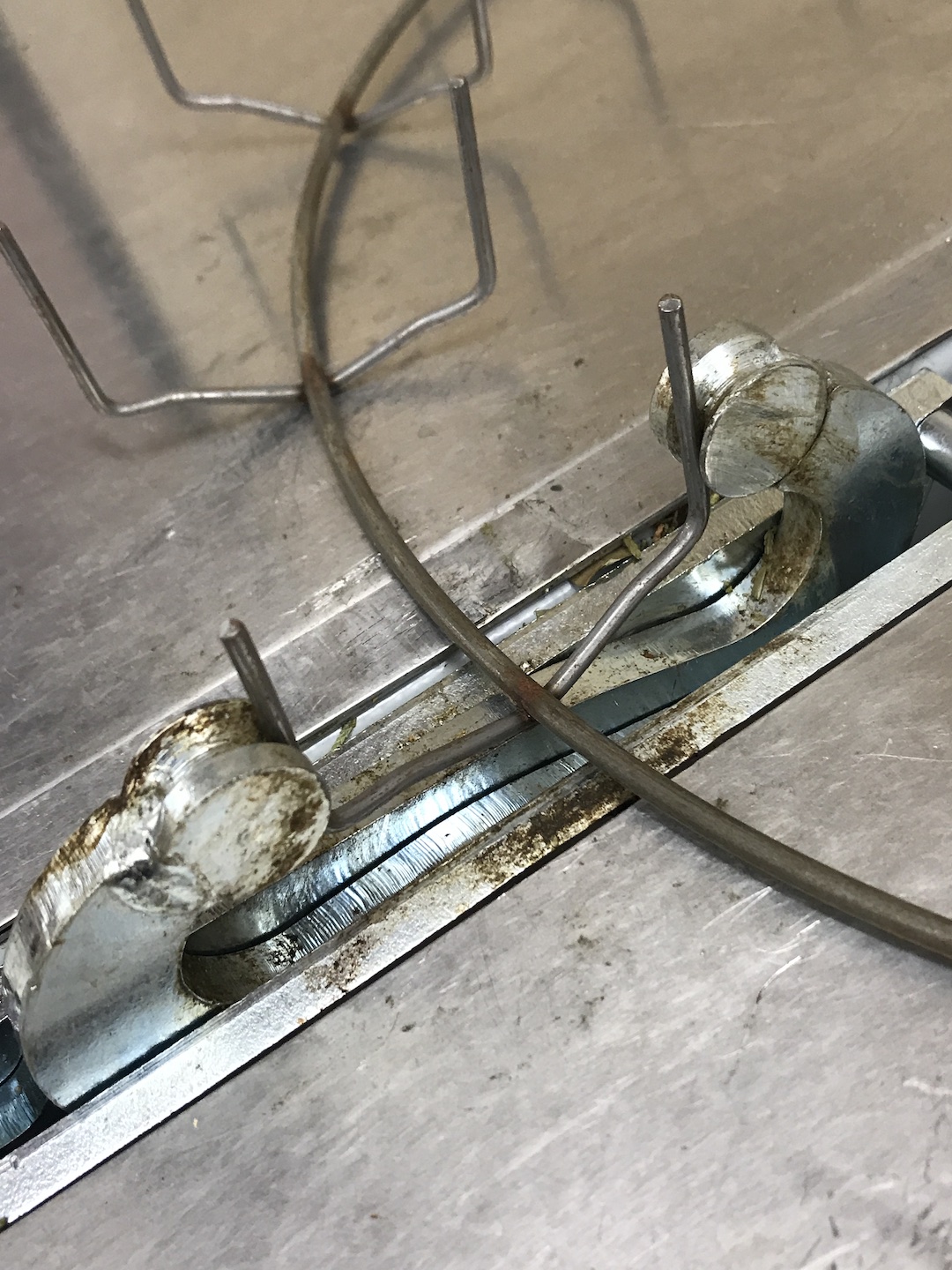 Clamp machine used to press prongs around plant.