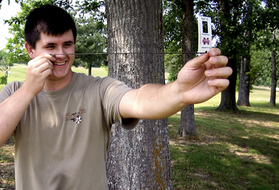 A guy gauging basal area.