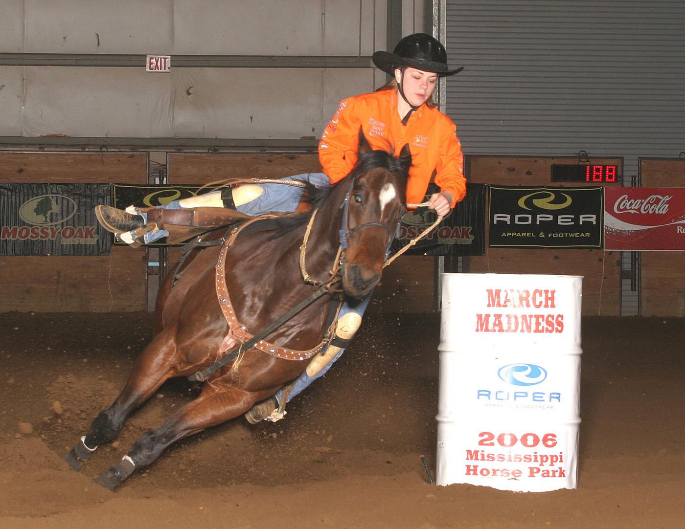 Kass Downen, an 11th grader from Illinois, makes a turn around a barrel at the March Madness Barrel Race held this spring at the Mississippi Horse Park in Starkville. Downen was this year's average champion and won $3,585 with four runs totaling less than a minute.