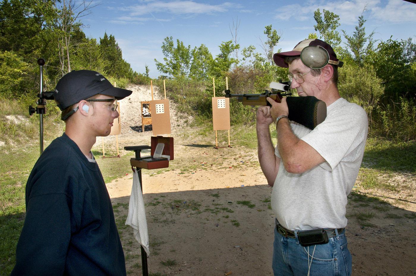 Luke South of Tishomingo County receives instruction from Coach William Baldwin at the Mississippi 4-H National Shooting Sports team practice held at the Starkville Gun Club. (Photo by Scott Corey)