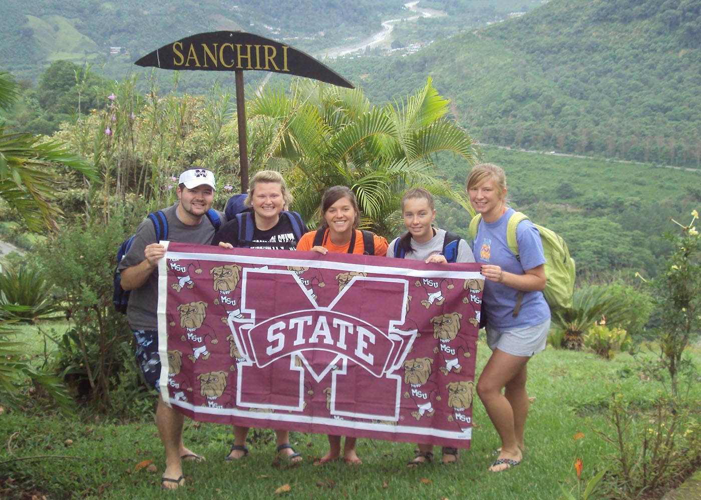 Mississippi State University College of Veterinary Medicine students (from left to right) Brolin Evans, Katie Cooley, Kellie Horton, Stephanie Starling and Brittany Fisher display their MSU pride while volunteering in Sanchiri, Costa Rica. (Photo submitted)