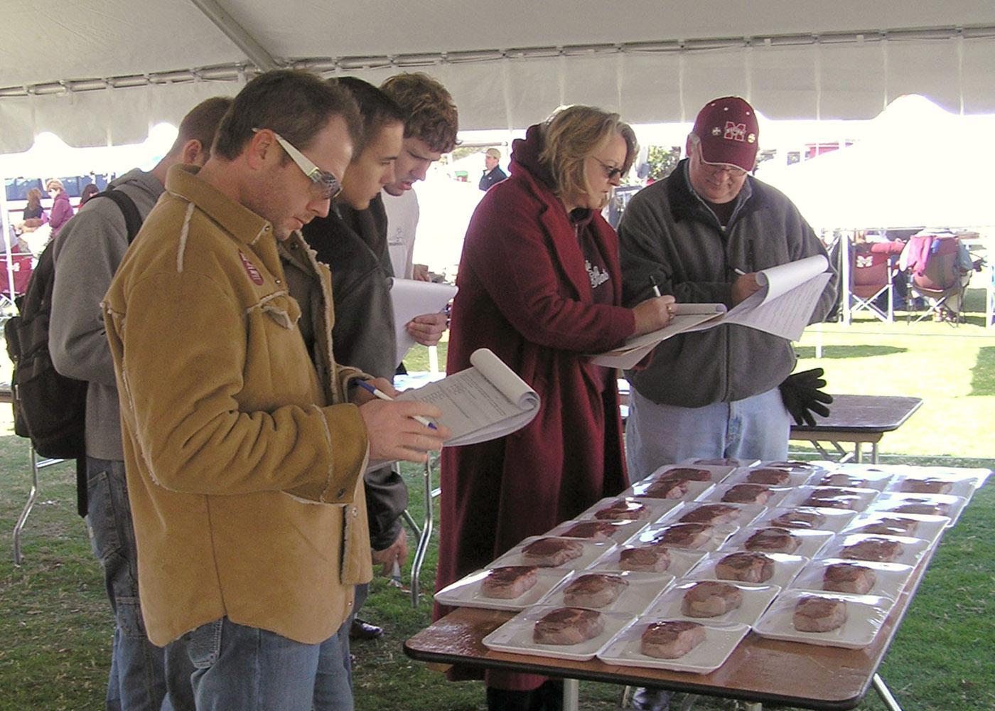 Participants in a Mississippi Agricultural and Forestry Experiment Station research project rate steaks displayed in Mississippi State University's Junction. The research team was gauging the public's willingness to pay extra for a thicker, heartier steak. (Photo by MSU Food Science, Nutrition and Health Promotion/Jason Behrends)