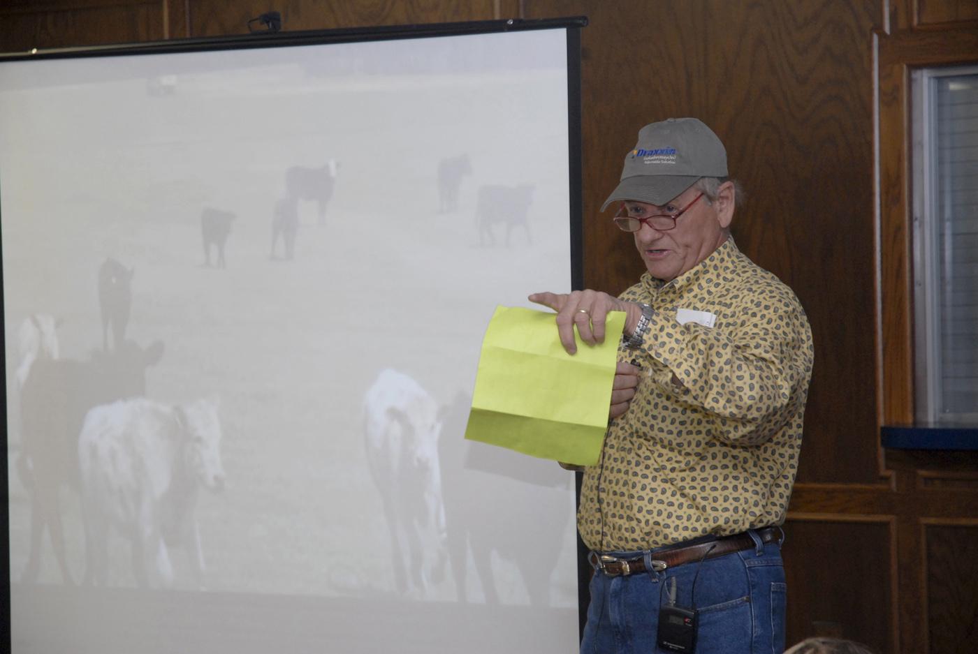 Ray Welch, owner of Winona Stockyards, serves as the auctioneer for the Cattlemen's Exchange and Homeplace Producer Sale held in April. Buyers see video segments and read descriptions of cattle lots as they bid on the animals. More than 2,000 cattle were sold in less than an hour with total receipts approaching $1.9 million. (Photo by Linda Breazeale)