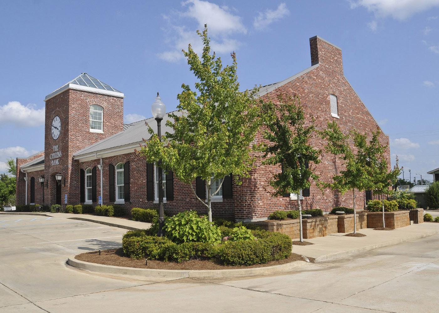 Trees planted at the east and west ends of a building, such as those at The Citizens Bank of Philadelphia branch in Starkville, provide shade and reduce energy use.