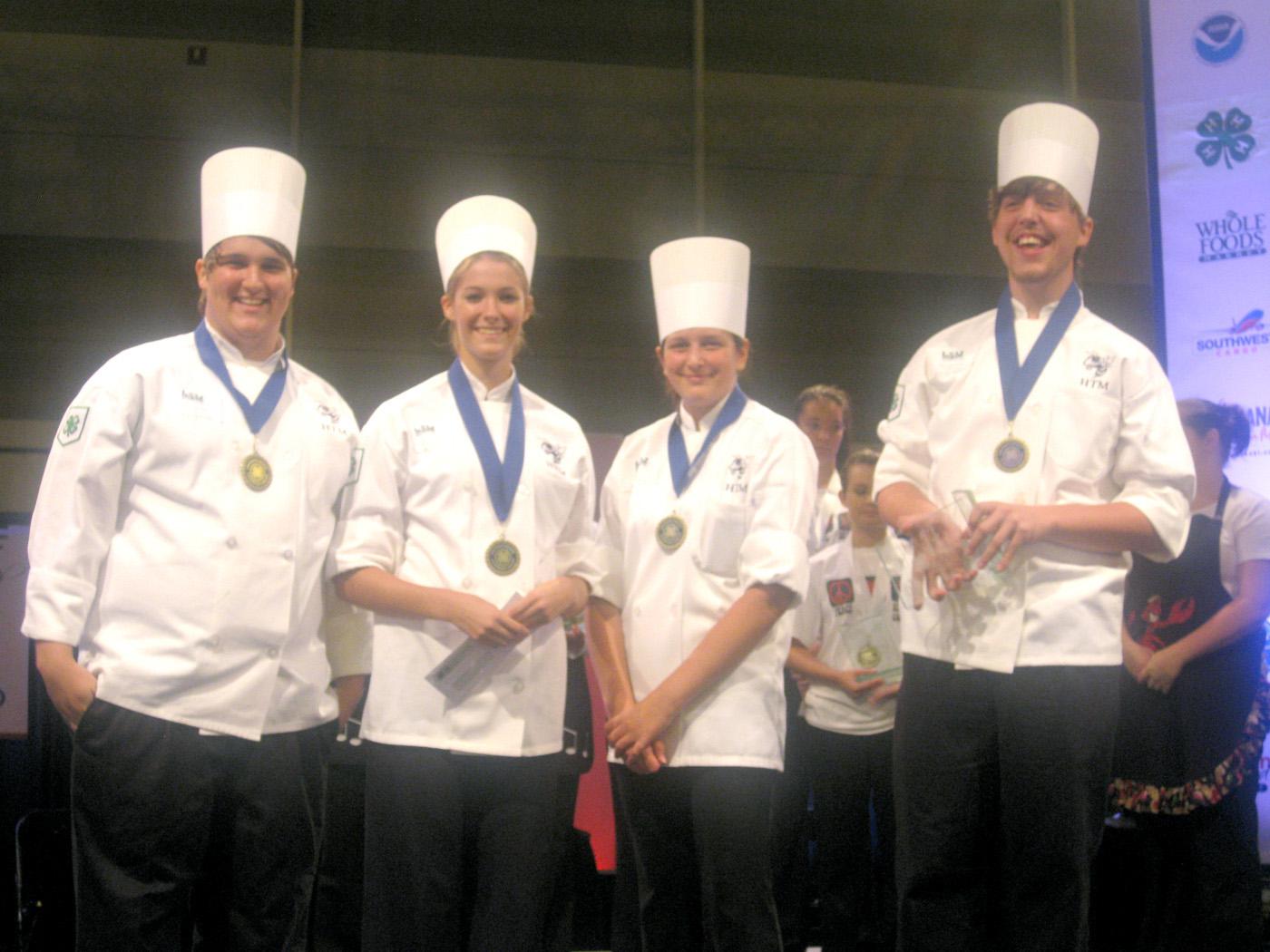The Jackson County 4-H team of chefs from St. Martin High School (from left), Cory Martin, Sarah Soares, Adriana Wilson, and Jarod Harris, were named grand champions of the first-ever Southern Regional 4-H Seafood Cook-Off, held in conjunction with the Great American Seafood Cook-Off in New Orleans. (Submitted photo.)