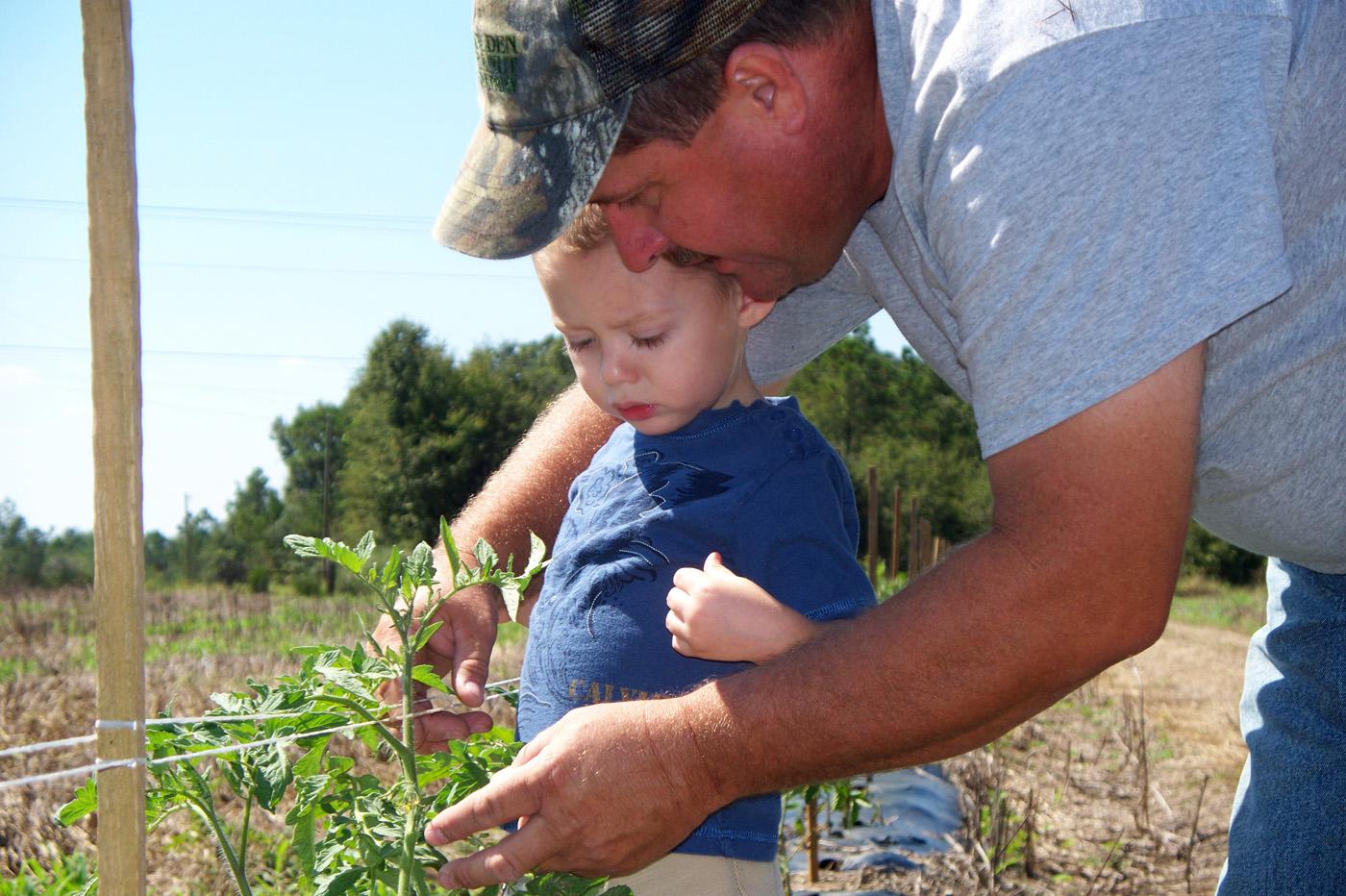 Mike Steede, pictured with his nephew Gunter, and his family operate a community supported agriculture program on land their family has farmed for over a century.