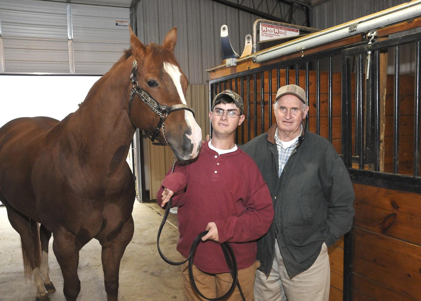 After multiple surgeries and extensive physical therapy for cerebral palsy, Jamie Mangum, pictured with his horse Bubba and grandfather James Roy Hawkins, shows halter horses without assistance. (Photo by Scott Corey)