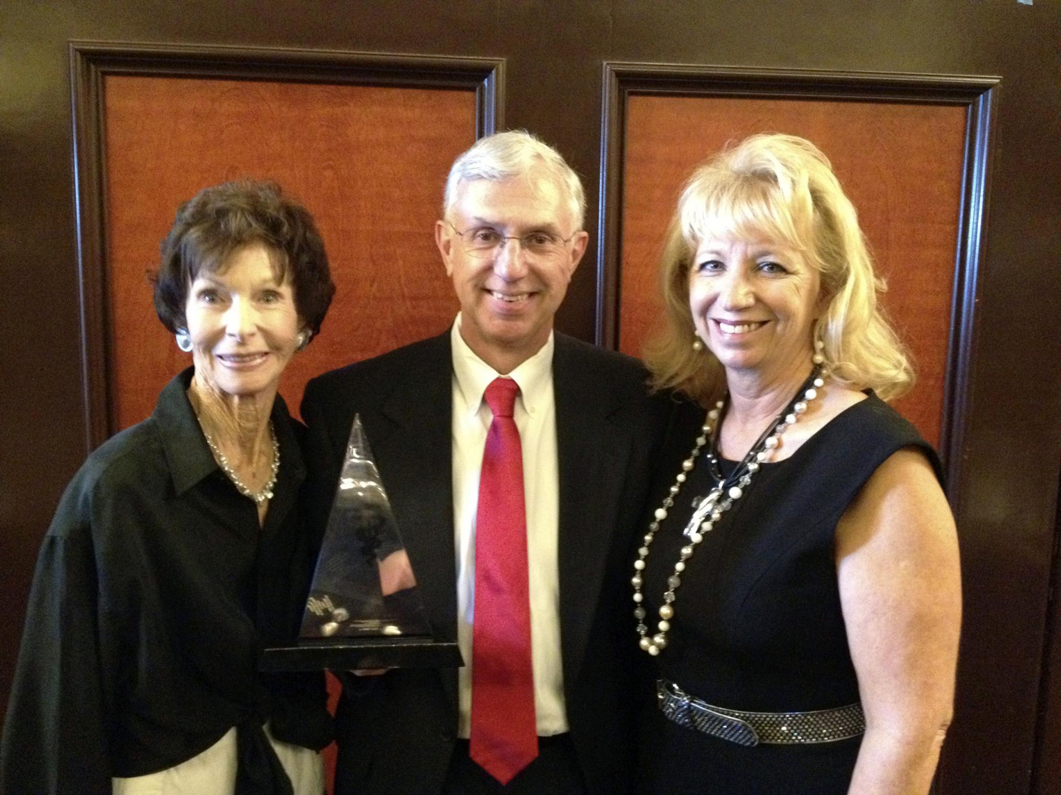 Dr. Phil Bushby (center) celebrates his Animal Welfare award from the American Veterinary Medical Association with Marcia P. Lane (left) and his wife Retha. Bushby holds the Marcia P. Lane Endowed Chair in Humane Ethics and Animal Welfare at the Mississippi State University College of Veterinary Medicine. (Submitted Photo)