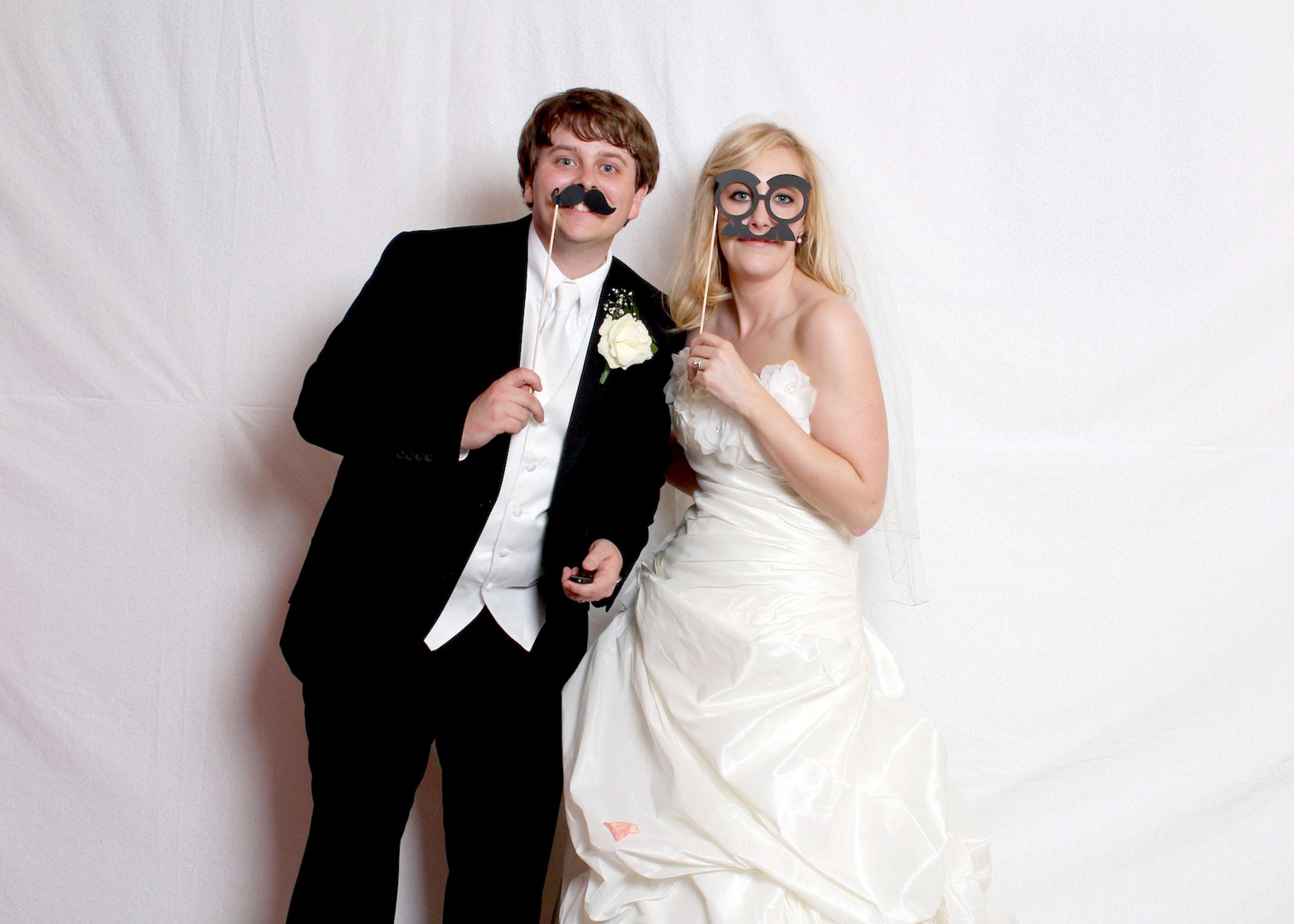 A photo booth at the wedding reception gives newlyweds a chance to take informal pictures that complement their formal portraits and capture the lighthearted side of their relationship. (Submitted Photo)