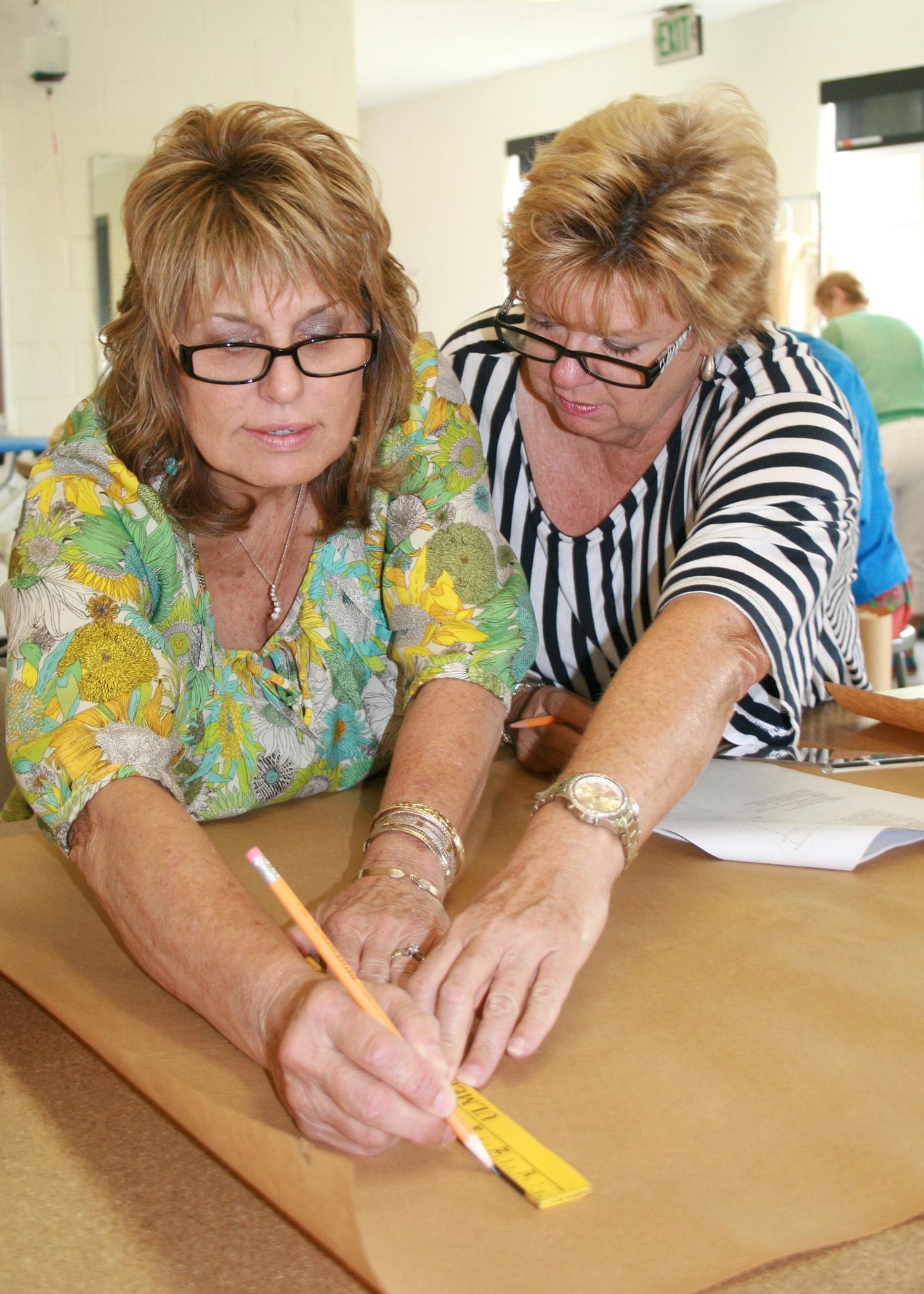 From left, Ramona Edge, Itawamba County Extension coordinator, and Shelaine Pennington, Prentiss County Extension coordinator, learn how to make a flat pattern Aug. 1 during the annual Master Clothing Volunteers conference at Mississippi State University. (Photo by MSU Extension Center for Technology Outreach/Mariah Smith)