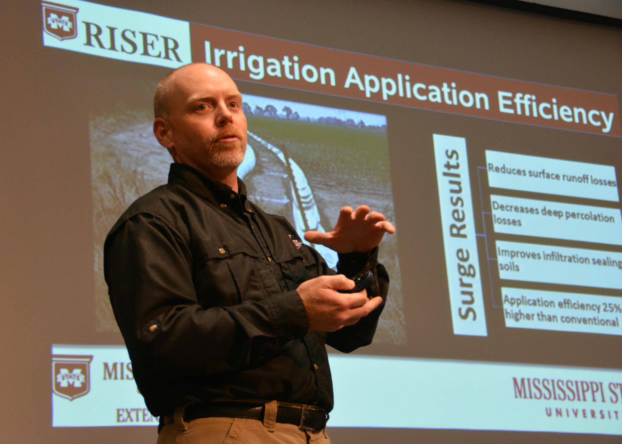 Jason Krutz, irrigation specialist with the Mississippi State University Extension Service, addresses water efficiency on cropland during the Mississippi Delta Irrigation Summit in Stoneville, Mississippi, on Dec. 10, 2014. (Photo by MSU Ag Communications/Linda Breazeale)