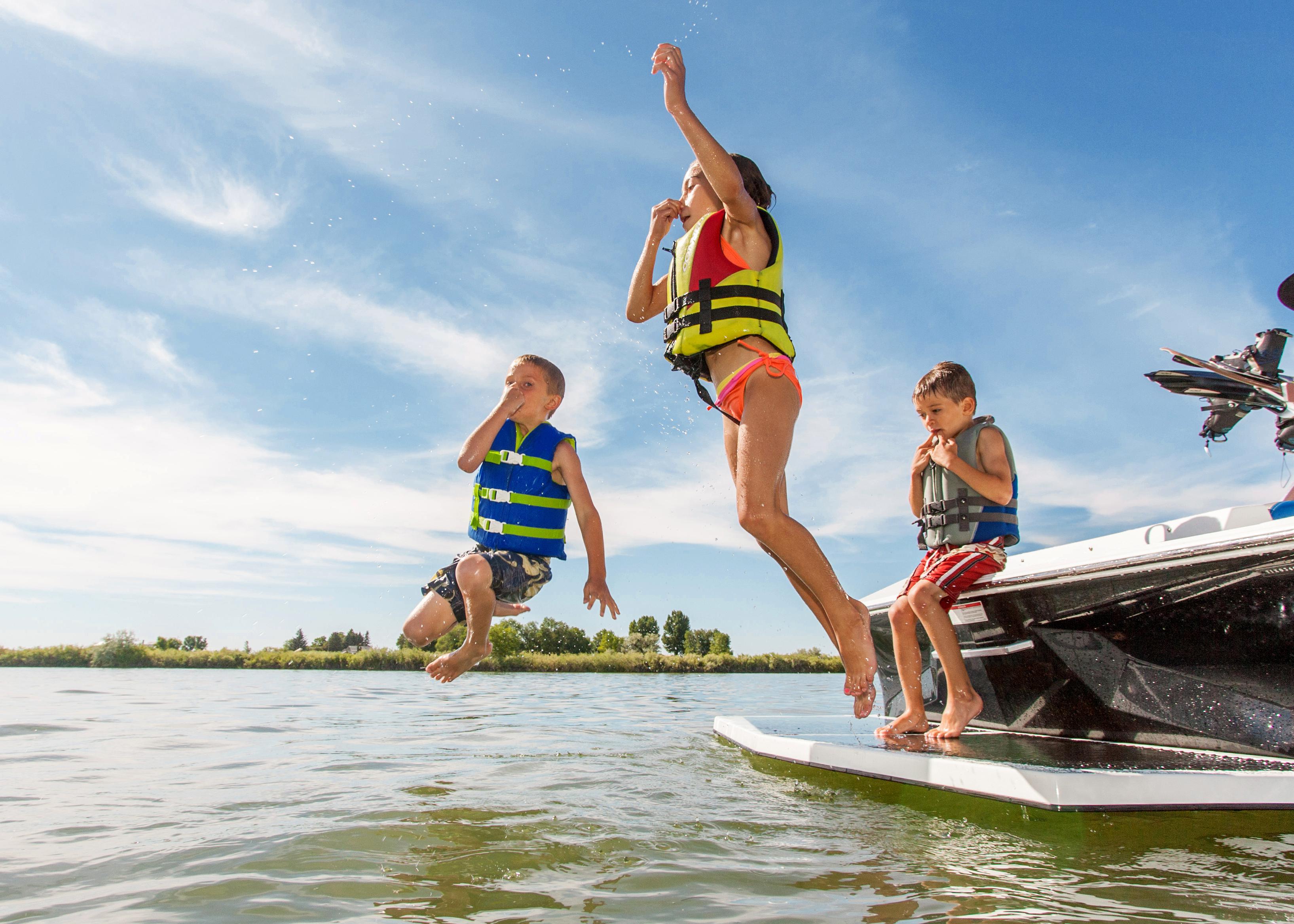 Kids jumping in a lake