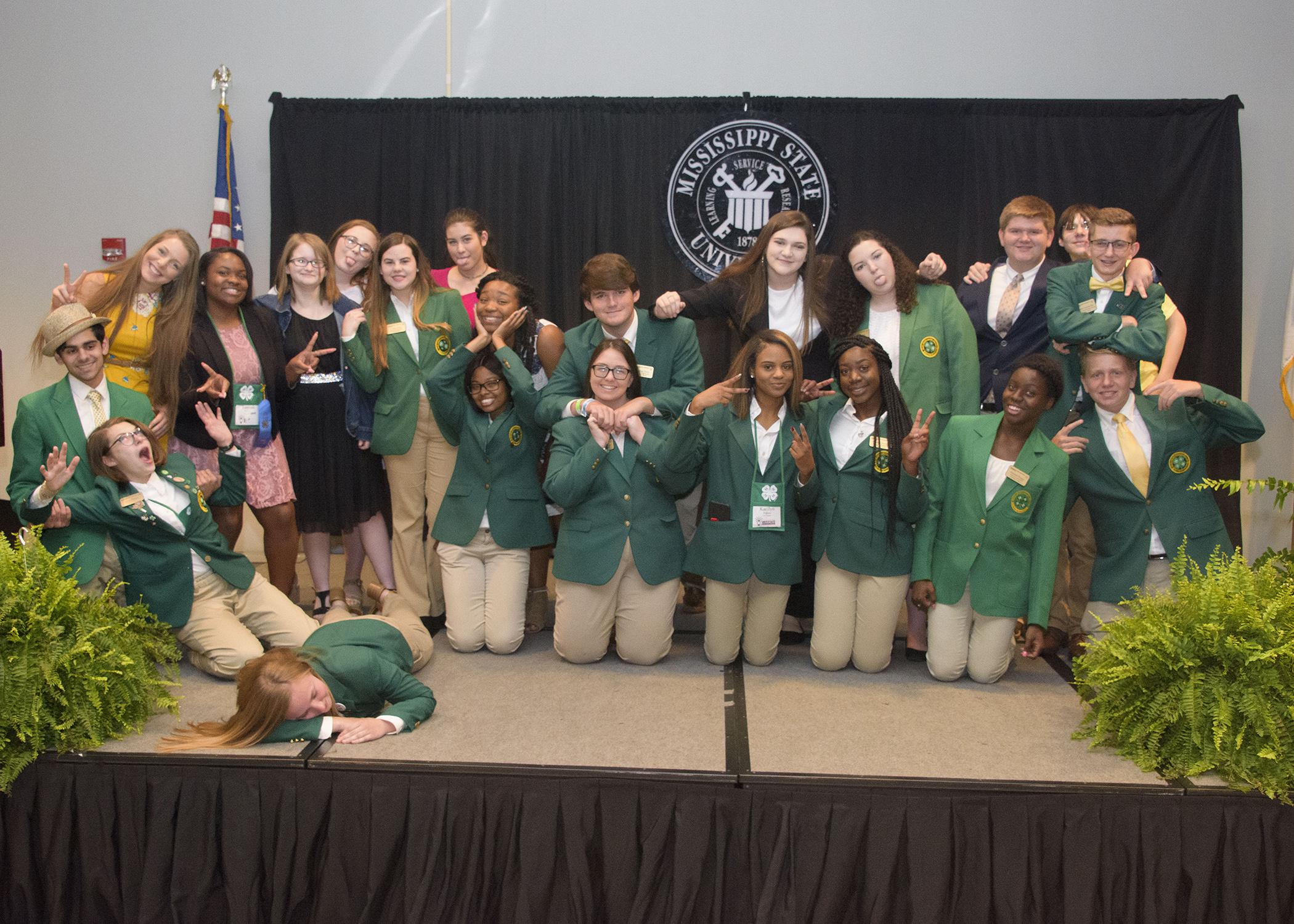 A group of 4-H’ers make silly gestures.