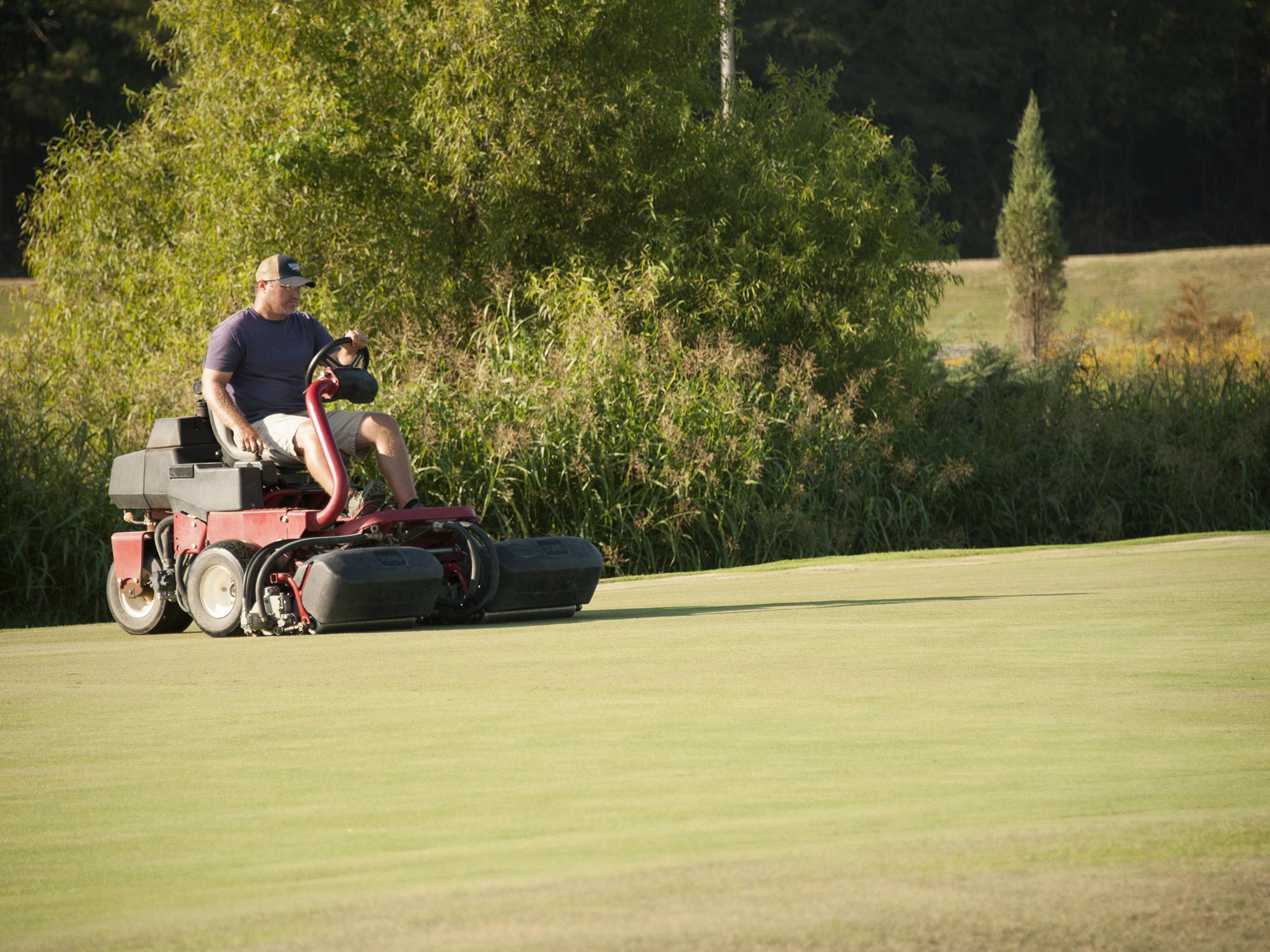 William Ruffin, a research associate with the Department of Plant and Soil Sciences at Mississippi State University, mows turf research plots at the R. R. Foil Plant Science Research Center Sept. 8, 2016. (Photo by MSU Extension Service/Kat Lawrence)