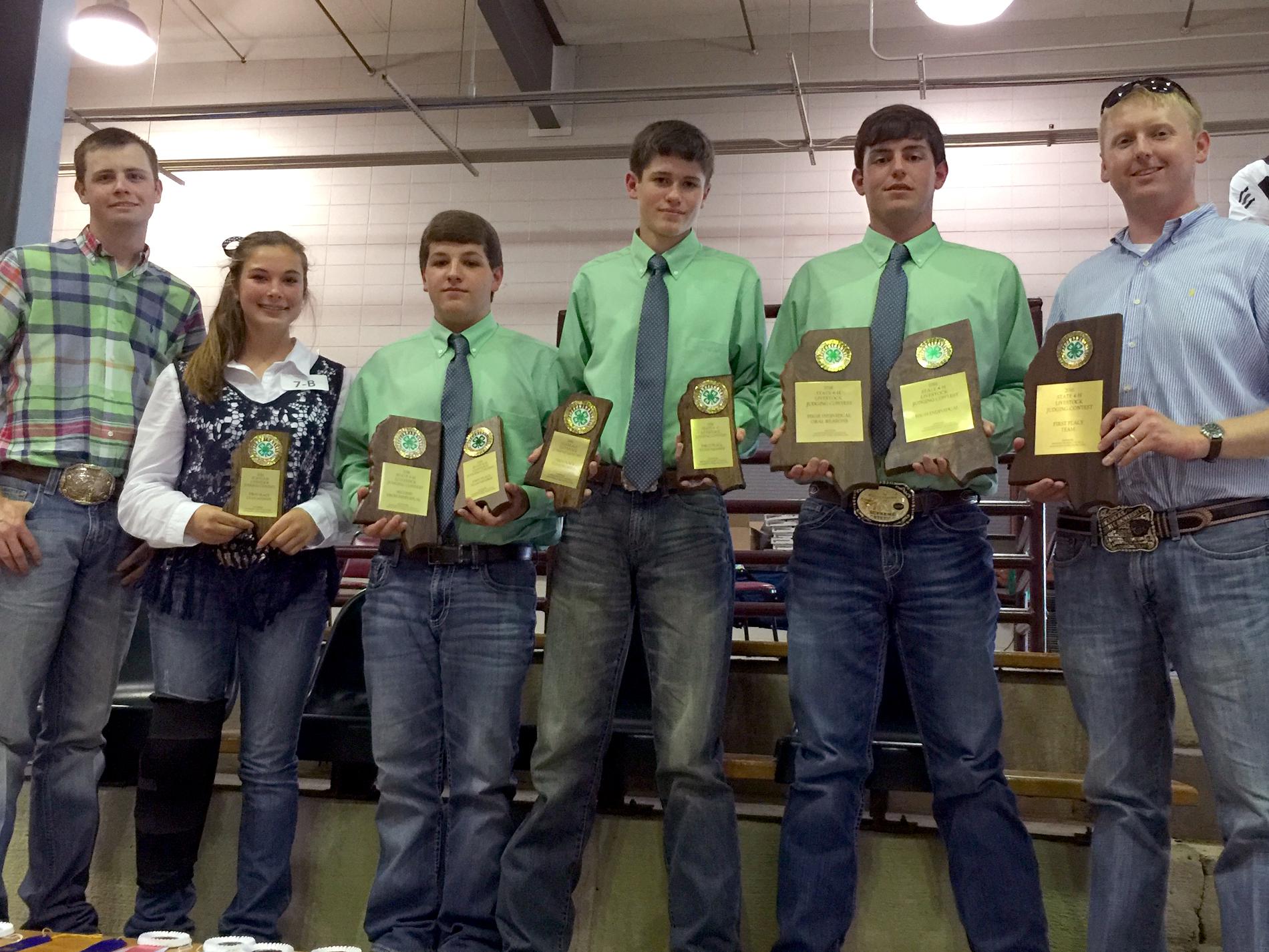 Tucker Wagner, far left, a graduate student in the Mississippi State University Department of Animal and Dairy Sciences, and Brett Crow, far right, an instructor in the department and coach of the MSU Livestock Judging Team, are pictured with the Lincoln County 4-H team at the statewide 4-H/FFA livestock judging contest. The event was held at the MSU Horse Park in Starkville, Mississippi, on May 21, 2016. Team members from left are Rylie Melancon, Walker Williams, Jacob Johnson and Will Watts. (Submitted Ph