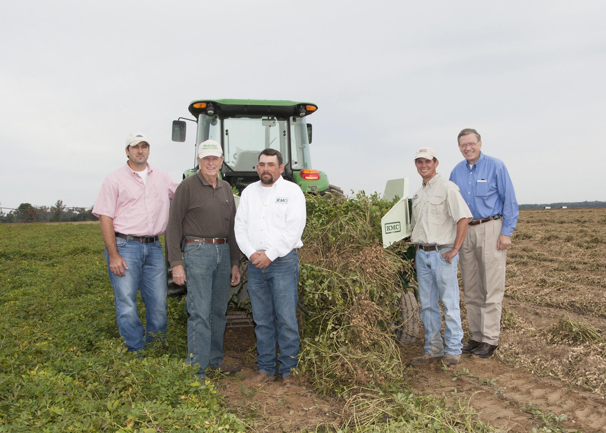 A two-row digger shaker donated to the Mississippi Peanut Growers Association by Kelley Manufacturing Company was demonstrated recently at Parrish Farms in Holmes County. On hand for the demonstration were, from left, Brad Burgess, Mississippi State University’s variety testing director; Malcolm Broome, Mississippi Peanut Growers Association executive director; Keith Weeks, KMC territory manager; Daniel Parrish, MPGA board member; and Reuben Moore, Mississippi Agricultural and Forestry Experiment Station as