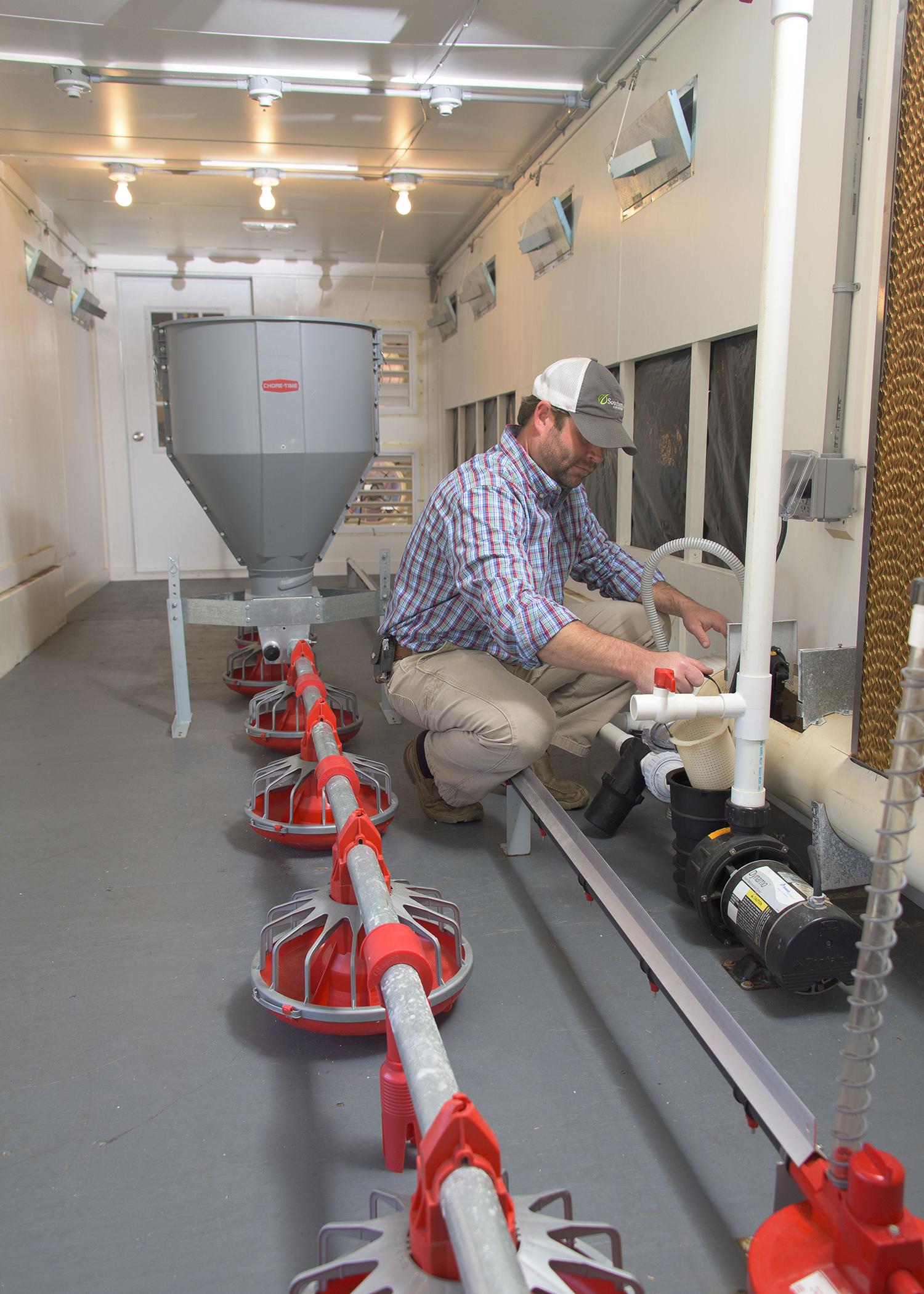 Mississippi State University research associate Daniel Chesser tests a new pumping unit inside the Mobile Environmental and Energy Lab at Mississippi State University Oct. 29, 2015. (Photo by MSU Extension/Kevin Hudson)