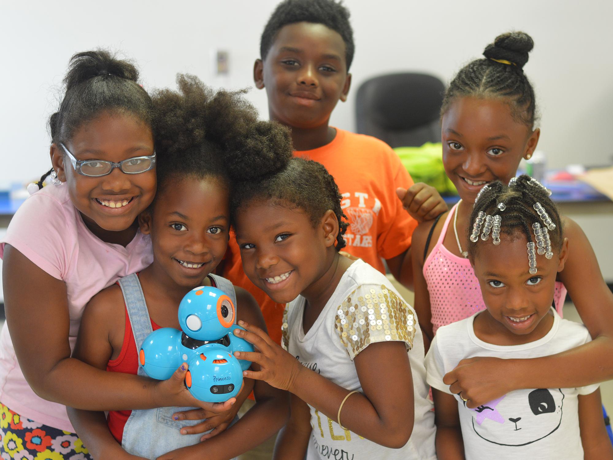 Campers (front row, from left) Jendiya Harkins, Jayda Robson, Ankeria Harkins and Morgan Peterson; and Travis Jones and Ceniyah Jamison learn robotics at a community summer camp on July 11, 2016 in Artesia, Miss. The Mississippi State University Extension Service and 4-H uses robotics to introduce children to science, technology, engineering and mathematics programs at an early age. (Photo by MSU Extension Service/Michaela Parker)