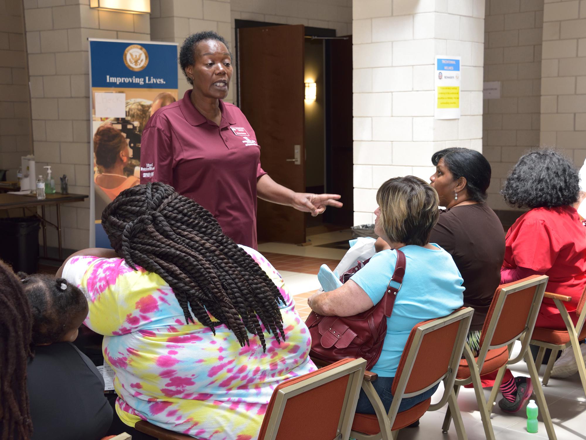 Dannie Bolden, Wilkinson County nutrition educator with the Mississippi State University Extension Service, speaks to participants of the wellness event about reducing fat and sugars in their diets in Natchez, Mississippi, on Aug. 9, 2016. (Photo by MSU Extension Service/Kevin Hudson)