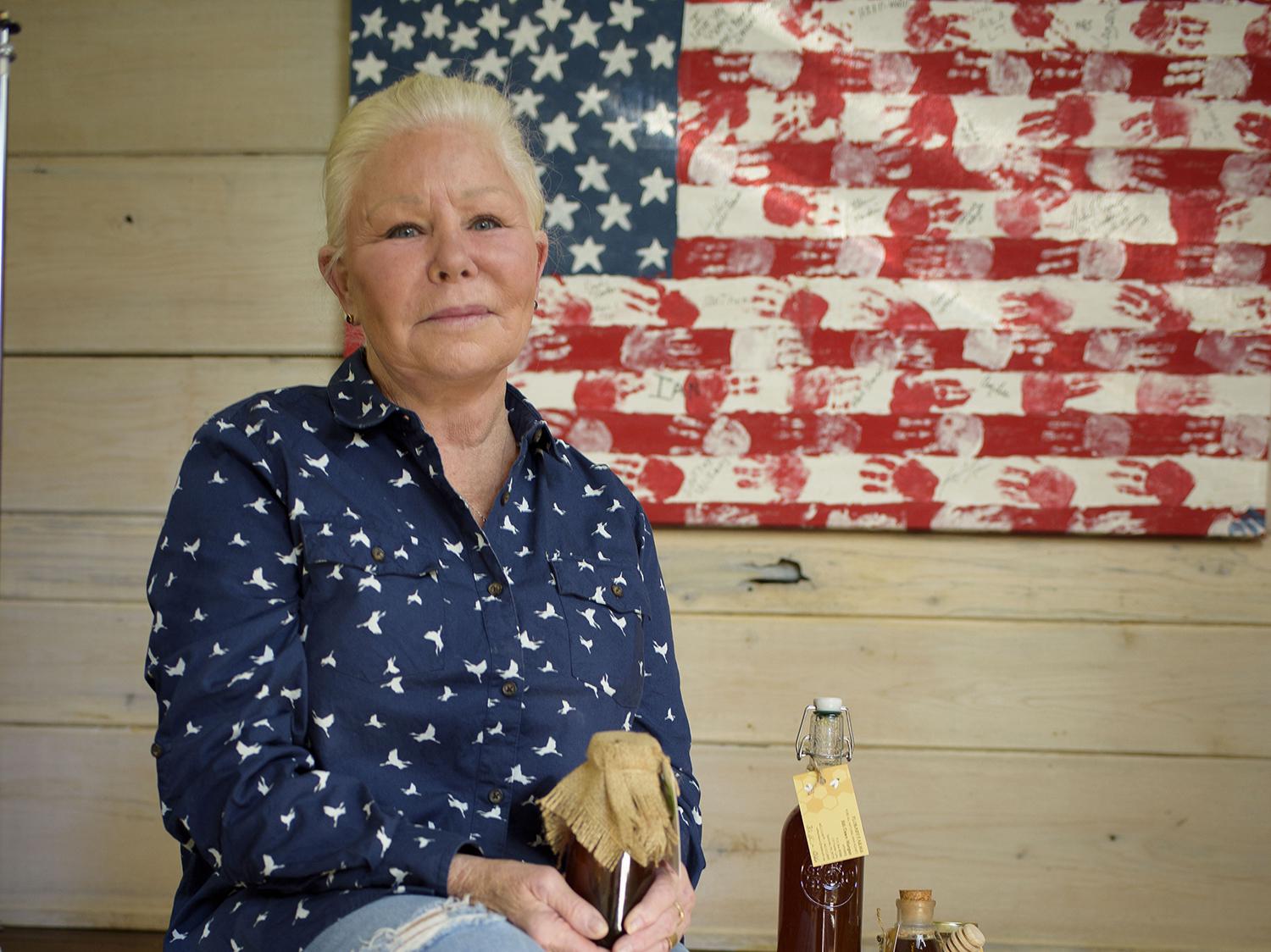 Dawn Morgan manages more than 20 hives at FloBaby Farms and sells raw honey, comb honey and beeswax from her home in Starkville, Mississippi on Nov. 22, 2016. (Photo by MSU Extension Service/Kevin Hudson)