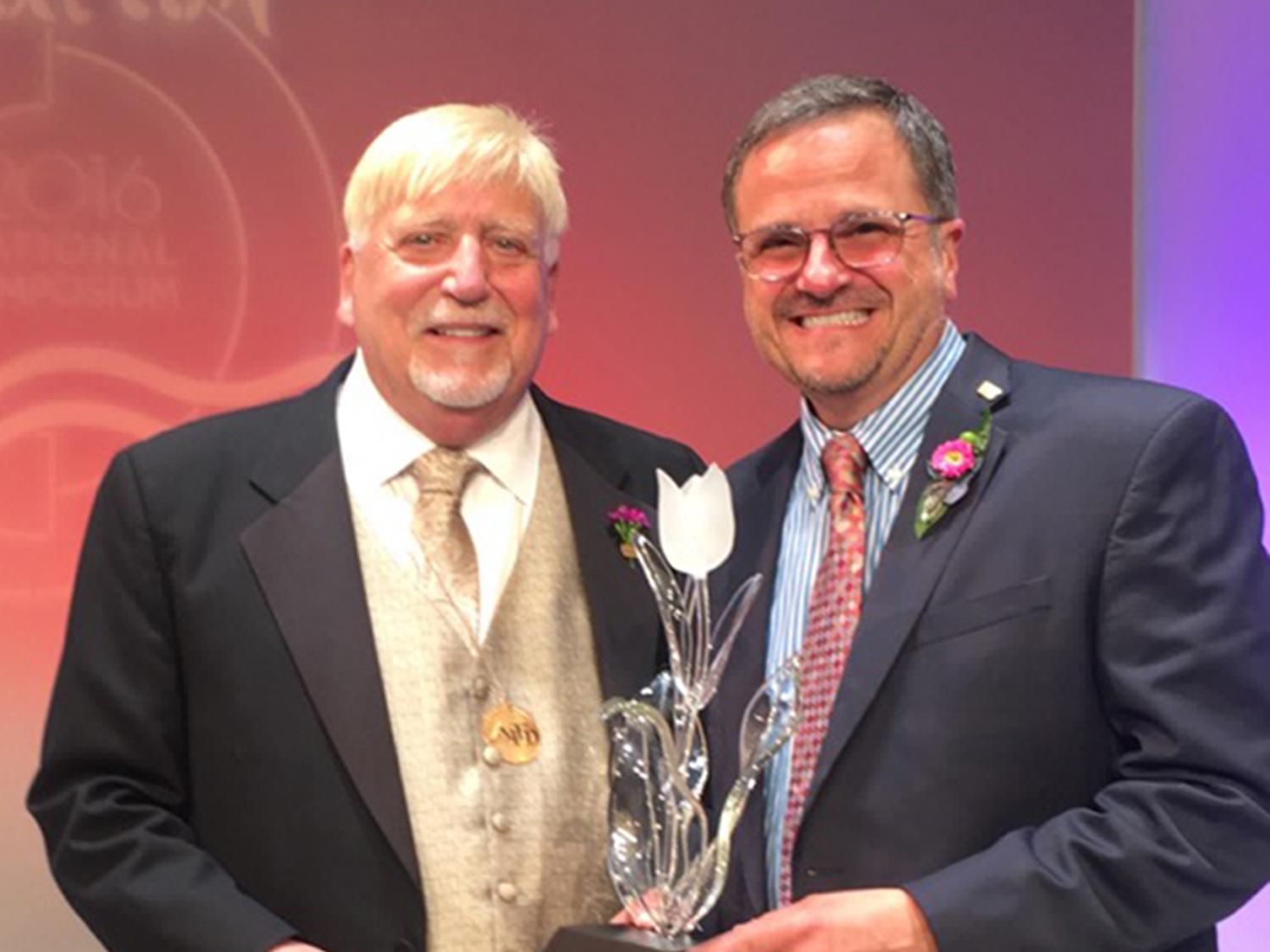 Mississippi State University Extension Service floral design specialist Jim DelPrince, right, accepted the American Institute of Floral Designers Award of Distinguished Service to the Floral Industry from Awards Committee Chairman Rich Salvaggio during the organization’s annual National Symposium in July. (Photo courtesy of American Institute of Floral Designers)