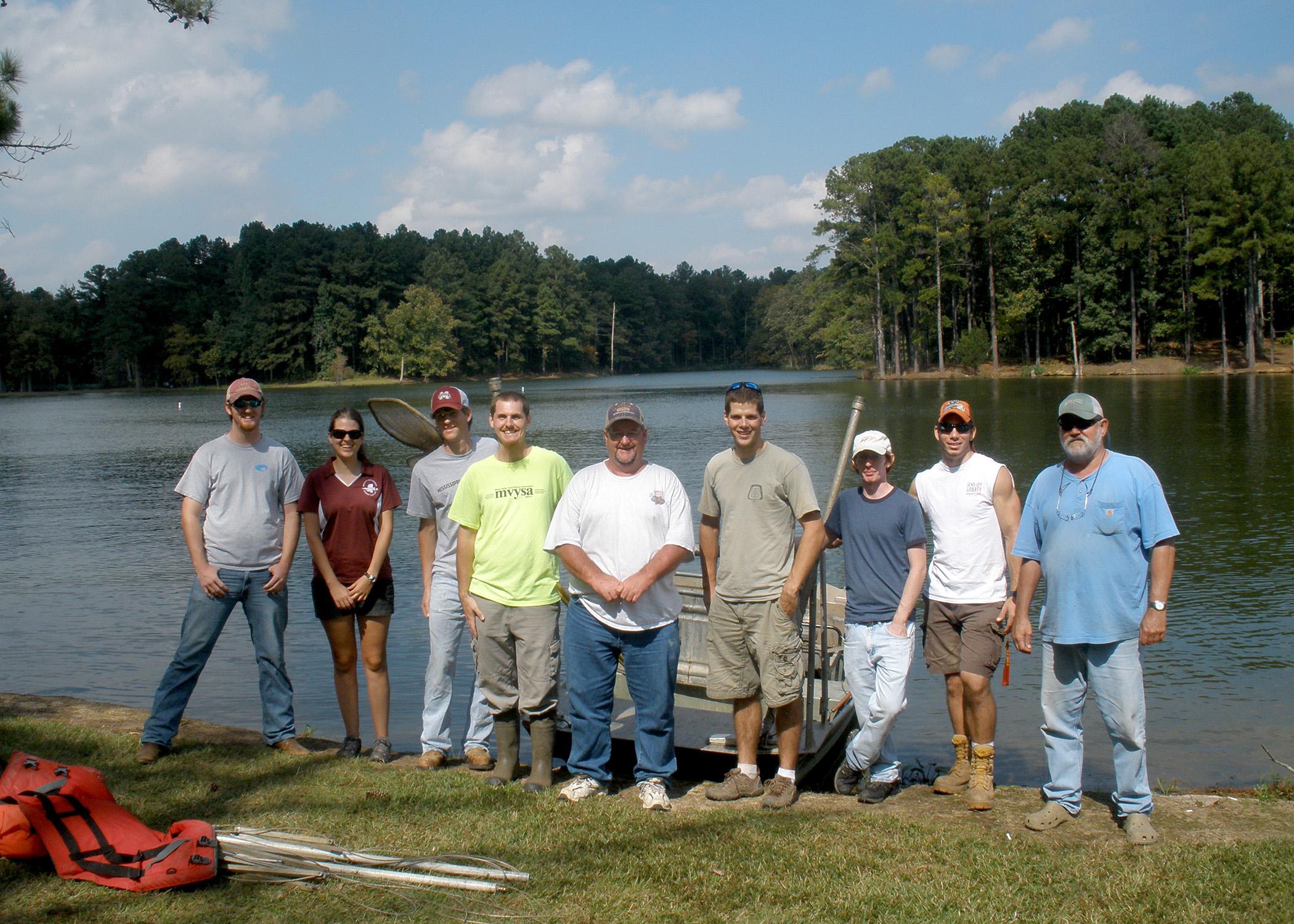 Mississippi State University students Thad Moody, Caroline Andrews, Trae Foster, Edward Entsminger, Dan Goetz, Bryant Haley and Alex Elkins prepare to sample the fish population in Larry Coleman and George Abrams' fishing pond. The students are members of MSU's chapter of the American Fisheries Society, which received the 2012 Outstanding Subunit Award during the AFS's regional meeting. (Photo courtesy of Caroline Andrews)
