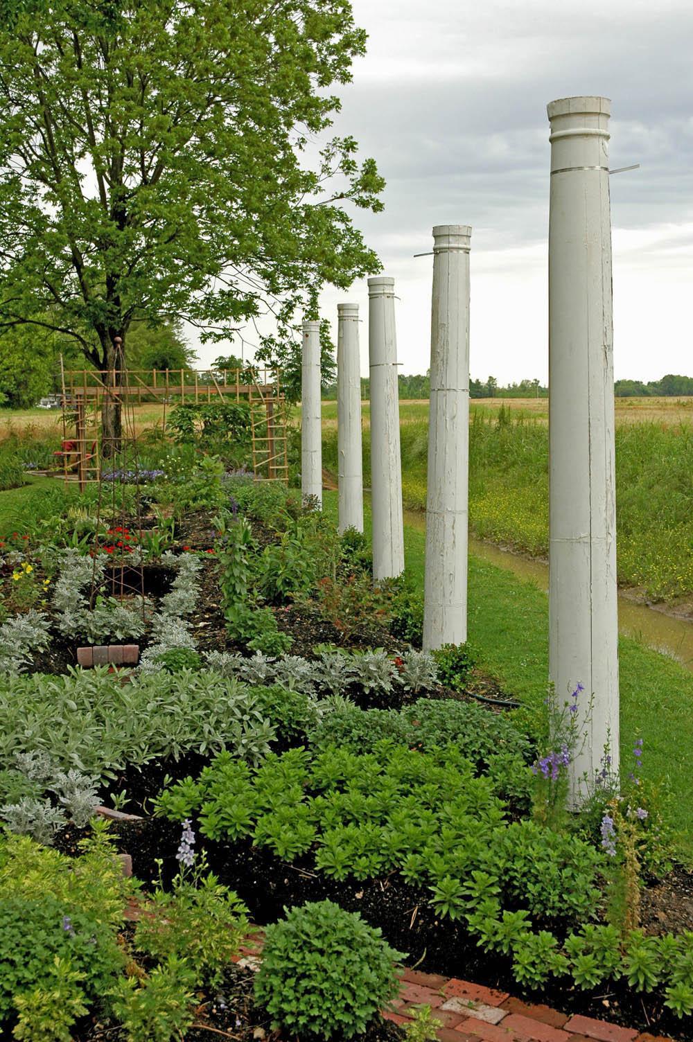 Columns from a former home provide a ghostly Southern archaeological feel to the edge of this Delta garden.