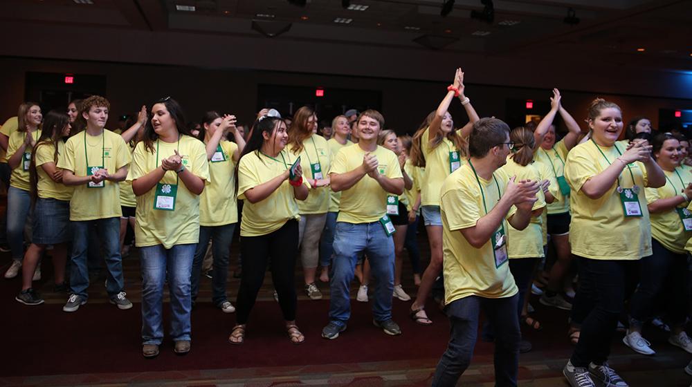 Large group of young people clapping at 4H State Congress.