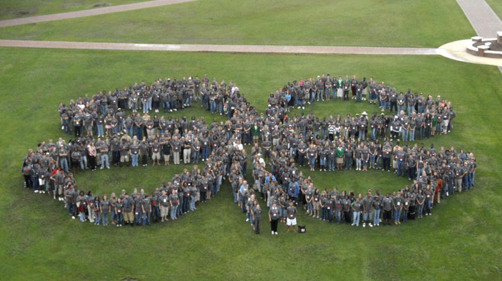 More than 600 4-H'ers gathered on the Mississippi State University campus to create a clover-leaf photograph to celebrate the 100th anniversary of 4-H in Mississippi. The perimeter of the shape was mapped out using GIS and GPS technologies.