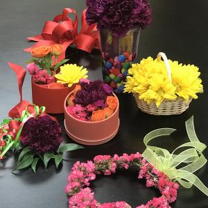 A variety of colorful, small-sized floral arrangements and projects.
