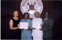 Virginia Whittington, president of the Mississippi 4-H Volunteers Association, (from left) presents a certificate for 60 years of service to Thelma Harris of Adams County and Dessie Burks of Madison County. The two volunteers were honored recently during the state 4-H Congress at Mississippi State University. Joining in the presentation is Harvey Gordon, 4-H volunteer development specialist with MSU's Extension Service.