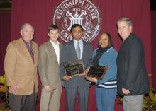 The Mississippi Agricultural and Forestry Experiment Station and the Mississippi State University Extension Service have presented 2006 Outstanding Worker Awards to K. Raja Reddy and Grenell Rogers. Reddy, center, is a research professor in the Department of Plant and Soil Sciences and Rogers, second from right, is an area Extension agent in Oktibbeha County. Presenting the awards were MSU Vice President for Agriculture, Forestry and Veterinary Medicine Vance Watson, left, Land Bank of North Mississippi Loa