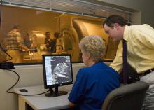 Sandy Brown, CVM Technical Supervisor, and Ryan Butler, CVM 2007 graduate, view an image during clinical scanning.