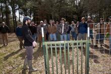Jay Cumbee, a USDA wildlife disease biologist, teaches Mississippi State University students about proper wild pig trap door design. An effective door is critical for wild pig trapping. (Photo by Scott Corey)