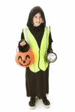 Safety experts advise trick-or-treaters to carry a flashlight, wear shoes that fit properly, avoid long costumes that could cause tripping and use reflective tape on costumes and candy buckets. (Photo by Lisa F. Young/Photos.com)