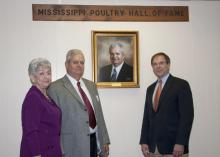 Coyt "Bud" West was inducted into the Mississippi Poultry Association's Hall of Fame for his many years of dedication to the poultry industry. West was joined by his wife, Gwen (left), and Mississippi Poultry Association President Mark Leggett (far right) at the Nov. 17 event. (Photo by Kat Lawrence)
