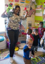 Child-care provider Dana Smith leads a dance session with Levi Mills, Carmus Batemon, Jakob Reyes, Auston Simpson and Langston Simpson at her in-home child-care program in Olive Branch. Busy Bundles of Joy Learning Center was recently recognized as a five-star center by the in-home Quality Rating and Improvement System. (Photo by MSU Extension Service/Alicia Barnes)