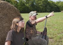 Ashley Ward with Ducks Unlimited and John Long with the Mississippi State University Extension Service model proper eye and ear protection for dove hunting. (Photo by MSU Ag Communications /Kat Lawrence)