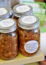 Under the new cottage food law passed in July 2013, Claude Jones and his daughter Cerilda can make a variety of canned goods, such as this salsa, in their home kitchen to sell at the farmers market. (Photo by MSU Ag Communications/Scott Corey)