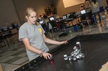 Renee Anderson, a member of a DeSoto County 4-H robotics club, prepares to test her robot's ability to chase an infrared ball, a task she programmed it to do. She took part in a five-day 4-H Robotics Academy hosted by the Mississippi State University Extension Service's Center for Technology Outreach. (Photo by MSU Ag Communications/Scott Corey)