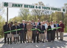 Mississippi State University Extension Service 4-H representatives, state and local officials, and industry representatives enjoy a beautiful day for a ribbon-cutting ceremony for the Jimmy Bryan 4-H Youth Complex in West Point April 10, 2014. Participants include Paula Threadgill, (front row, left), Angela Turner-James, Hobson Waits, Jimmy Bryan, Floyd McKee, Barney Jacks, Robbie Robinson, Paige Lamkin and Amy Berry; Lynn Horton (back row, left), Shelton Deanes, Preston Sullivan, Russell Jolly, Gary Jackso