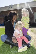 Samantha Jones enjoys a sunny afternoon with young students at the Child Development and Family Studies Center at Mississippi State University. Jones is one of more than 5,000 early care and education providers in the state of Mississippi. May 9 is Provider Appreciation Day, which is celebrated each year on the Friday before Mother's Day to recognize service providers and educators of young children. (Photo by MSU School of Human Sciences/Alicia Barnes)