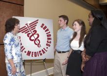 The Rural Medical Scholars program at Mississippi State University is designed to address the state's shortage of medical professionals. From left are Extension Service rural health program leader Bonnie Carew and three of the high school seniors who participated this year: Jason Carter of Horn Lake, Elizabeth Tedford of Clarksdale and Sabrina Micha of Starkville. (Photo by MSU Ag Communications/Kat Lawrence)