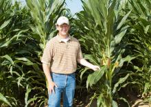 Brien Henry, an associate professor in the Mississippi State University Department of Plant and Soil Sciences, is visiting a research plot on June 19, 2014, at the R.R. Foil Plant Science Research Center, commonly known as North Farm. He is researching the effects of planting date, plant population and hybrid selection on field corn. (Photo by Mississippi Agricultural and Forestry Experiment Station/David Ammon)